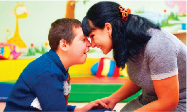 Woman providing personal care assistance to disabled child