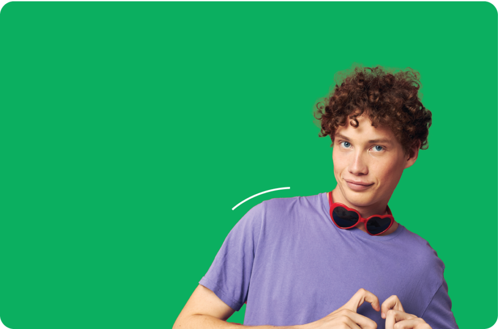 Boy with curly hair and heart-shaped sunglasses