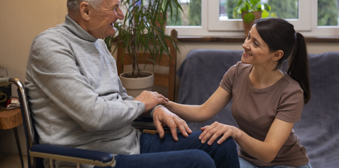 elderly person being taken care by female caretaker